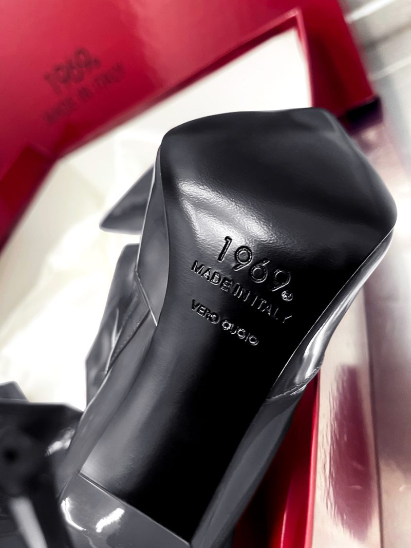 Close-up of the Vero Cuoio leather sole and 1969 Made in Italy branding on a grey patent boot.