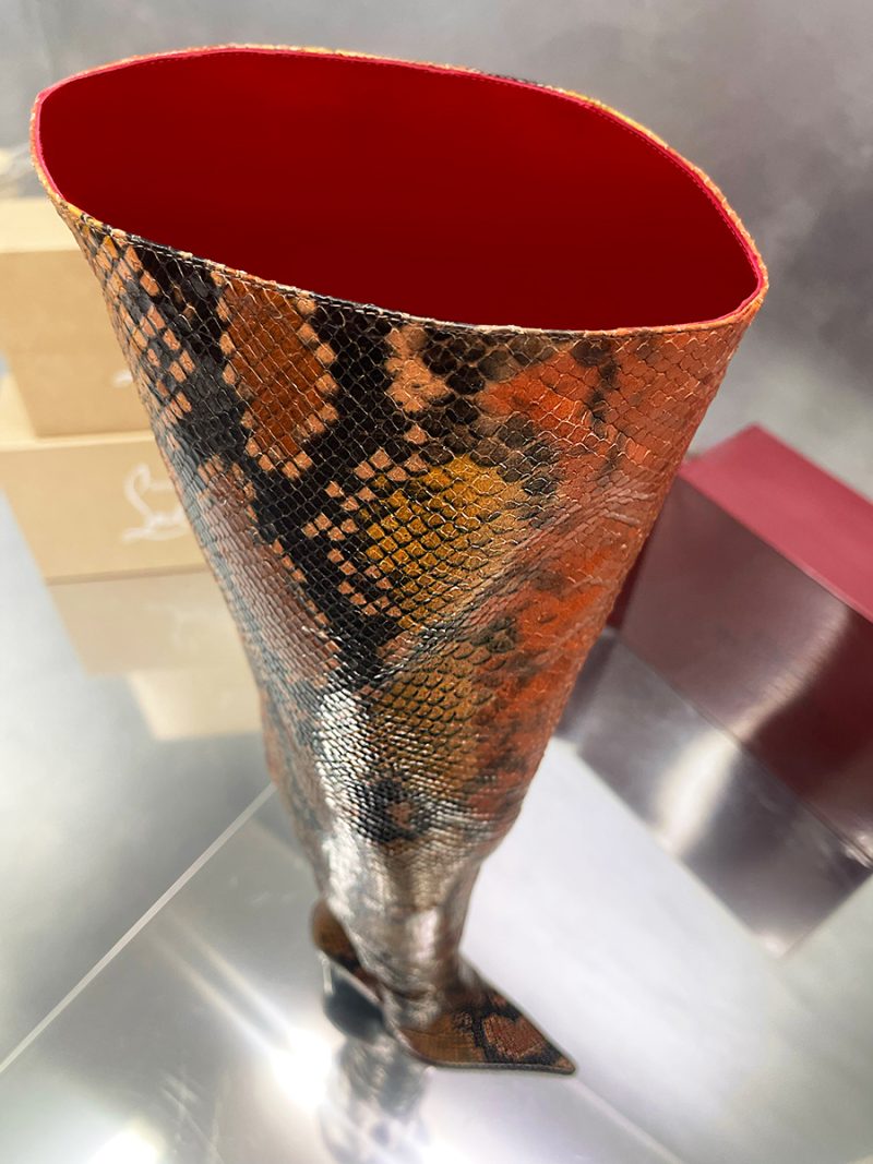 Top view of a Z25-3 python stamp overknee boot revealing the signature vibrant red leather interior.