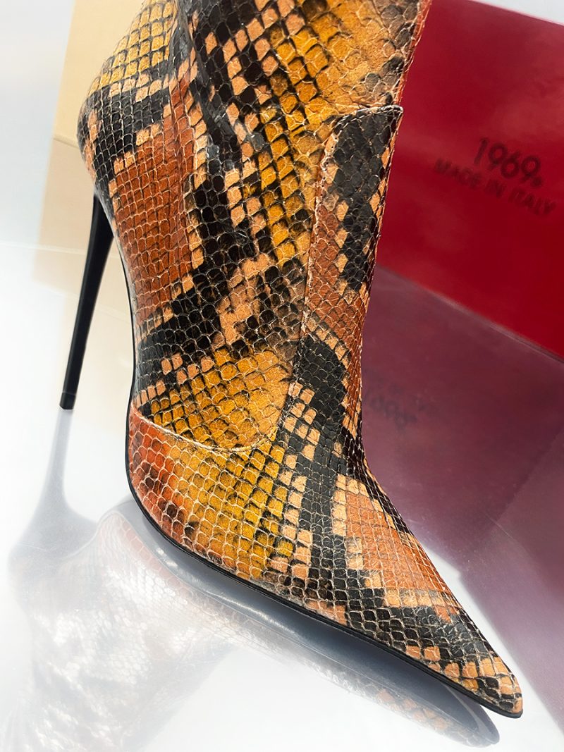 Macro view of Python stamp leather Z25-3 boot with extreme pointy toe and slender stiletto heel.