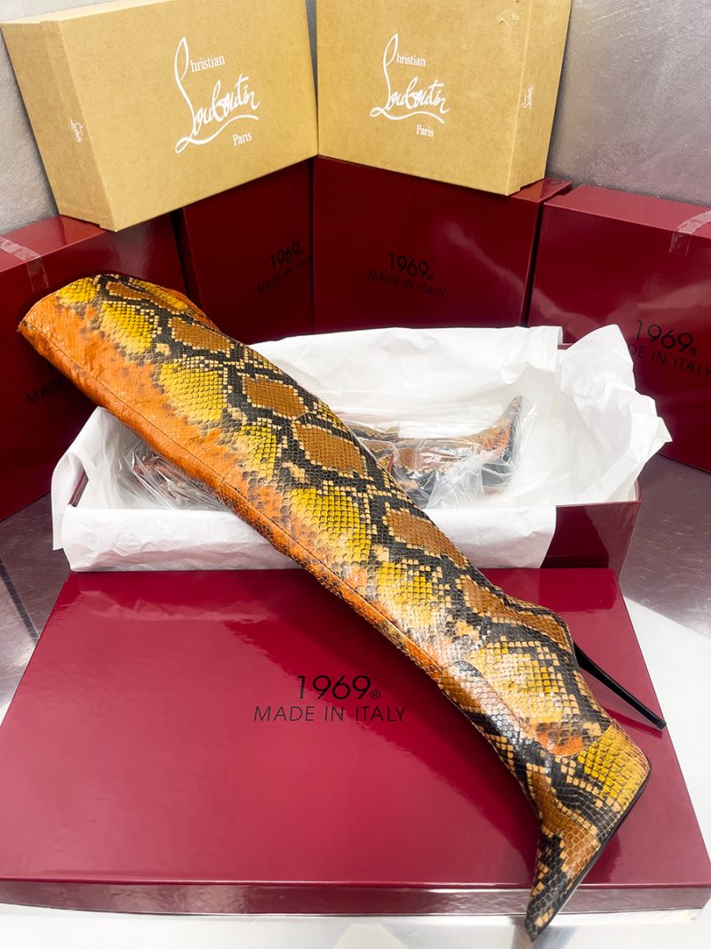 Python stamp leather overknee boot displayed on a 1969 Made in Italy red luxury shoe box.