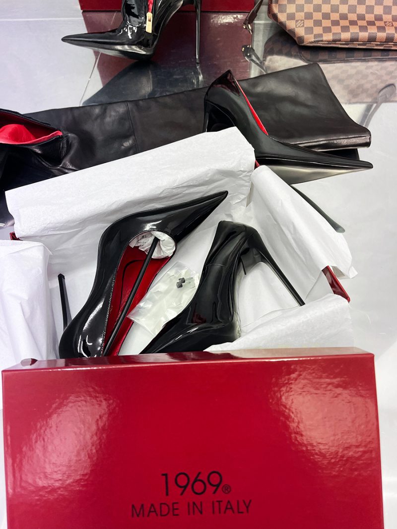 Unboxing 1969 LX E27 black patent leather pumps with luxury red box and tissue paper packaging detail.
