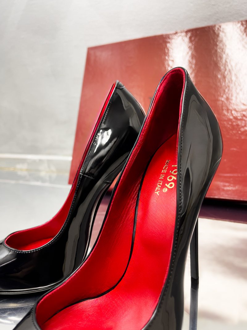 Interior detail of 1969 LX E27 black patent pumps showing the luxury red leather lining and gold Made in Italy logo.
