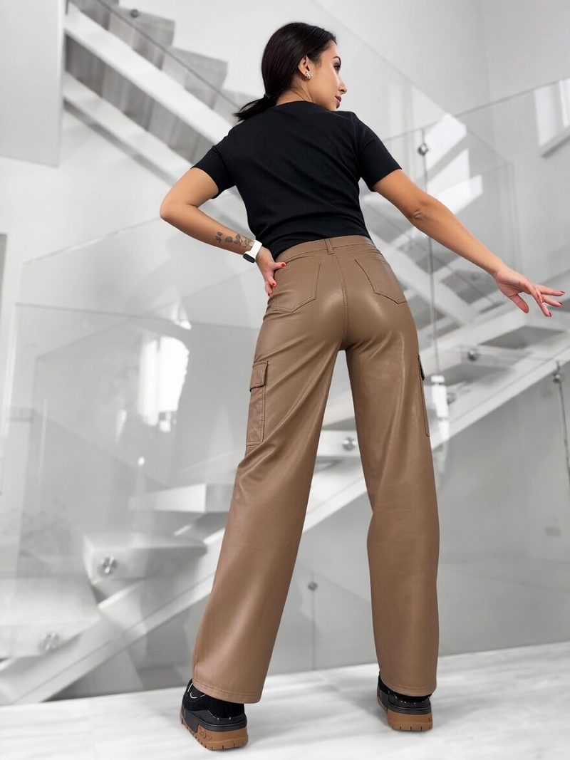 Full back view of dark beige cargo pants on a modern staircase